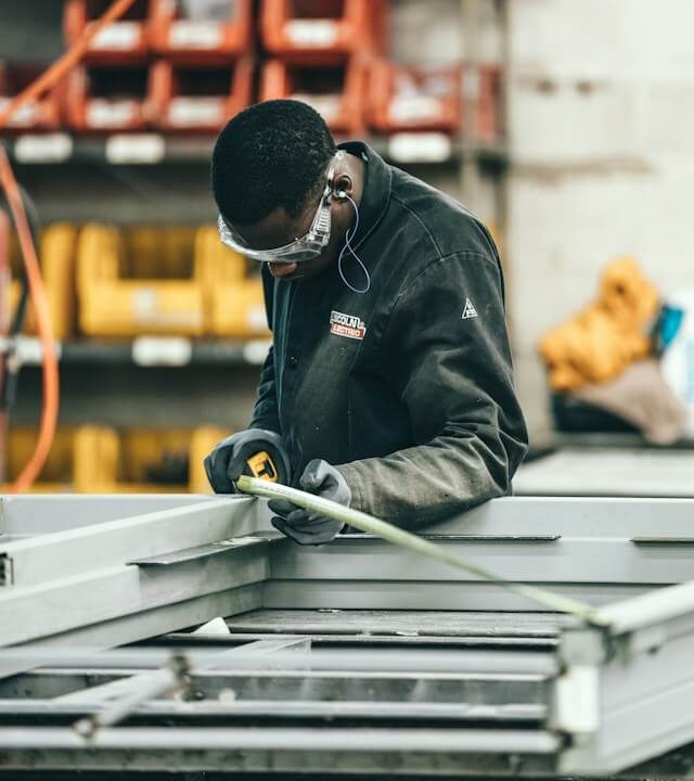 man measuring pallet